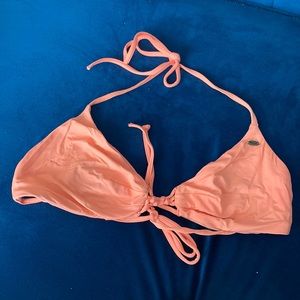 Orange O’Neill bikini top with knot middle.
